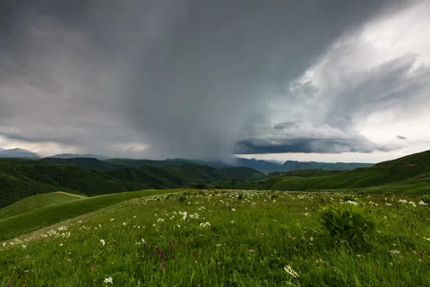 The formation of storm clouds over the mountains. Video stock 52772603