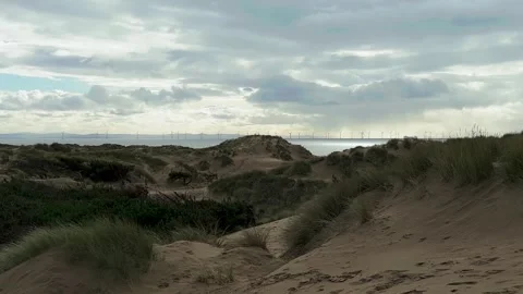 Formby sand dunes view of the coast and wind turbines 库存影片 266463702