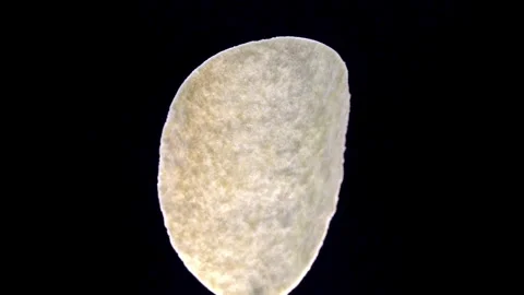 Formed Potato Crisp Rotating to Show Curved Geometric Shape Stock Footage 345426560