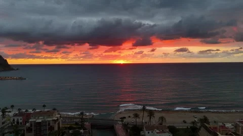 Formentera beach sunset with palm trees and dramatic Mediterranean cloudscape 動画素材 337140264