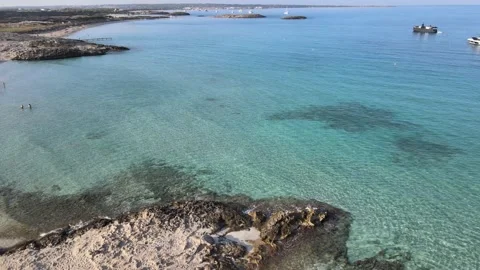 Formentera island beach crystal clear blue sea water drone aerial beautiful Stock Footage 164146653