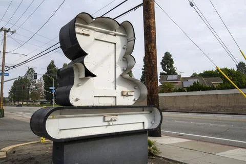 Former Chuck E Cheese restaurant entrance street logo sign. Stock Photos