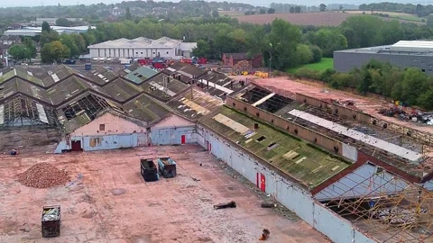 Former Glen Dimplex warehouse demolition aerial view orbiting the factory site Stock Footage 345407354