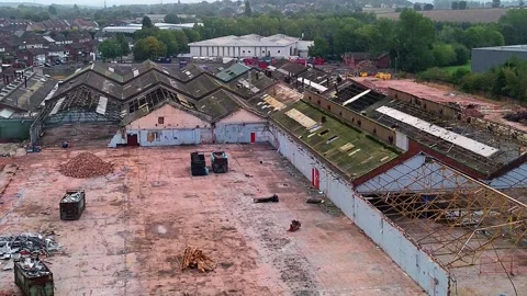 Former Glen Dimplex warehouse demolition aerial descend view over factory site Stock Footage 345407717