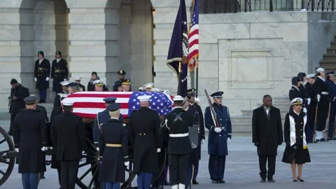 Former President Carter Arrives to Lay in State at the U.S. Capitol Building Stock Footage 297231653