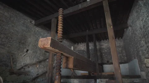 Former press grapes to make wine in a cellar Stock Footage 66455257