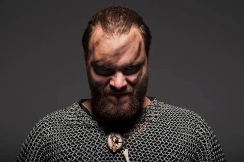 Formidable viking in chain armor over grey background Stock Photos