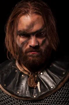 Formidable viking in chain armor over grey background Stock Photos