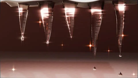 Forming beads, row of translucent icicles melting into droplets beneath overhang Stock Footage 340268344