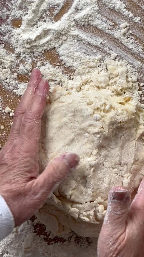 Forming biscuit dough for cutting Stock Footage 235631742