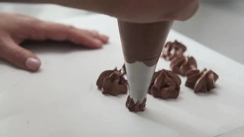 Forming chocolates or biscuit with a culinary syringe. Stock Footage 132787329