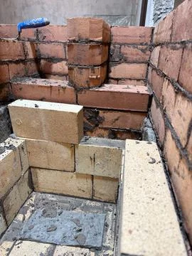 Forming the fireclay core of a solid fuel furnace, smoke deflector, building  Fotos de archivo