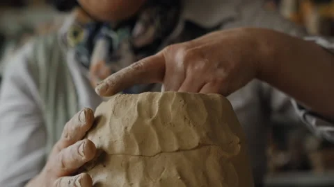 Forming a piece of clay Video stock 218604695