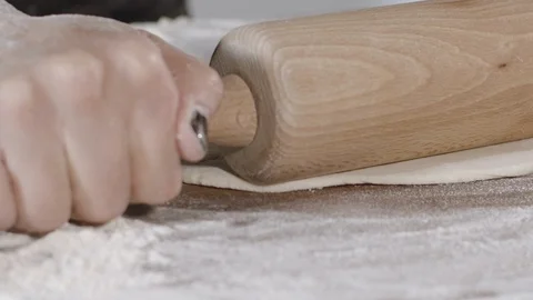 Forming pieces of dough for baking bread or pizza Stock Footage 124877971
