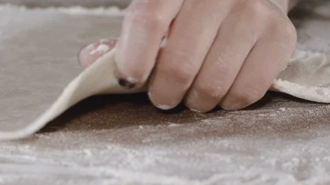 Forming pieces of dough for baking bread or pizza Stock Footage 124877989