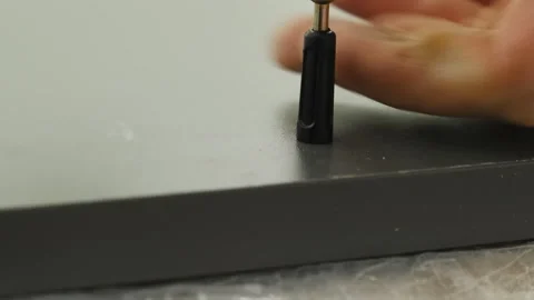 Forming small holes in drawer panel using special tool 스톡 동영상 316189429
