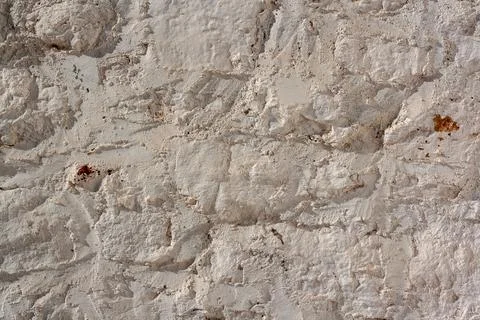 Formless wall covered with mortar. Horizontal photo. Stock Photos