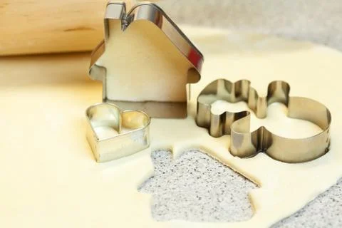 Forms for the cookies, rolling pin and dough Stock Photos