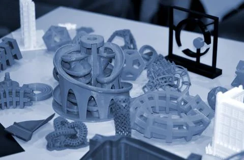 Forms printed by 3d printer. Objects printed on a 3d printer on a table. Stock Photos