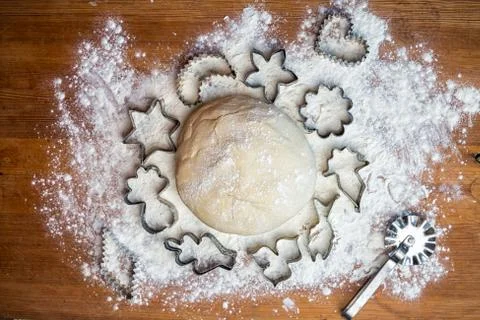 Forms for squeezing the dough. dough on the table with dough tools. Stock Photos