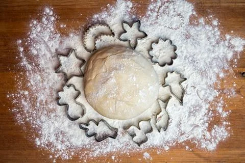 Forms for squeezing the dough. dough on the table with dough tools. Stock Photos
