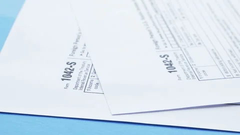 Forms of the tax return. Reporting of taxpayers. Forms 1040, 1042-s Stock Footage 86400424