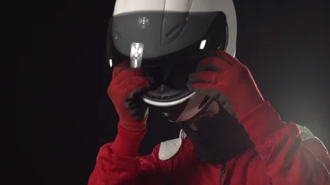 Formula One Motor Racing Driver putting on helmet. Grand Prix man. Stock Footage 125133081
