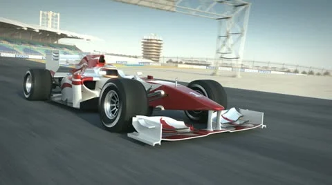 Formula one race car on desert circuit passing camera Stock Footage