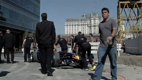 Formula One Red Bull Car Display, Crew Moving Car During Public Exhibition Stock Footage 240522357
