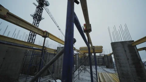 Formwork beams and scaffolding inside concrete construction site Stock Footage 327612165