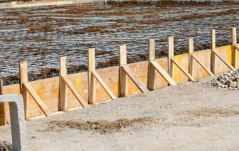 Formwork during laying cement to make the foundation of the building on the.. 库存照片