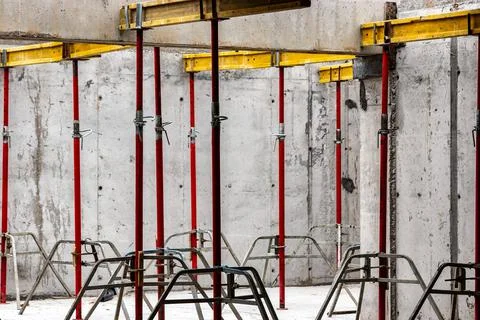 Formwork supports the second floor of a monolithic building. Reinforcement of Photos