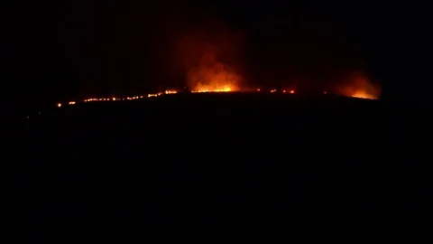 Forrest Fire on mountain at night. Wildfire Stock Footage 97742569
