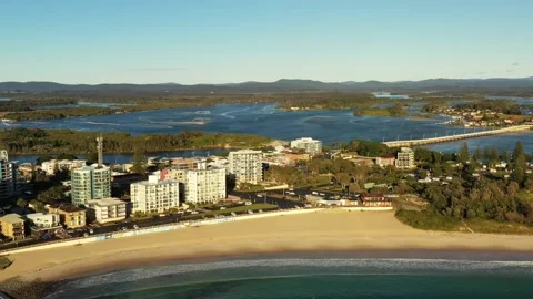 Forster beach with rock pool on waterfront of town – aerial flying 4k. Stock Footage 198665187