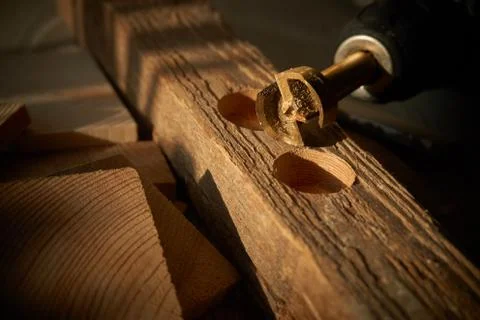 Forstner Bit and two different sized drilled holes Stock Photos