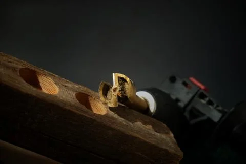 Forstner Bit and two different sized drilled holes Stock Photos