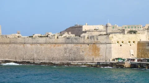 Fort st elmo and fort ricasoli bastion walls rise from the sea guarding the Stock Footage 341806299