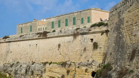 Fort st elmo building with green shuttered windows sits atop the cliffside Stock Footage 341806393