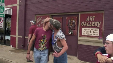 FORT WORTH, TX - 10/04/2009: Two Men Celebrate and Kiss During Gay Pride Parade Stock Footage 132298033