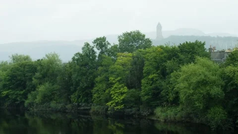 Forth River with the National Wallace Monument in the background raining Stock Footage 219493527