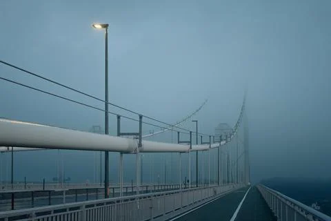 Forth Road Bridge covered in thick fog in the early morning Stock Photos