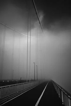 Forth Road Bridge covered in thick fog in the early morning Stock Photos