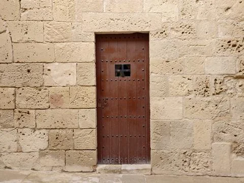 Fortified wall featuring aged timber door, Historical castle doorway with i.. Photos