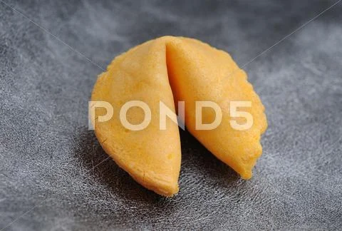 Fortune cookie on textured background Stock Photos