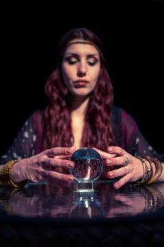 Fortune teller forecasting future with crystal ball Fotos de archivo