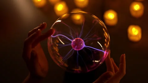 Fortune teller holding glowing plasma ball during divination session by Stock Footage 295264762