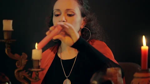 Fortune-teller lighting candles, predicting future, occult practice, witchcraft Stock Footage 170816291