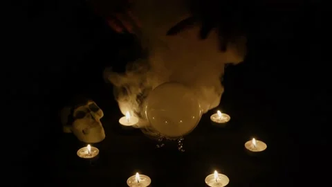 Fortune teller moving hands above the magic crystal ball, witch calling spirits Stock Footage 161654119