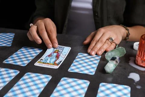 Fortune teller predicting future on spread of tarot cards at grey table, cl.. 스톡 사진