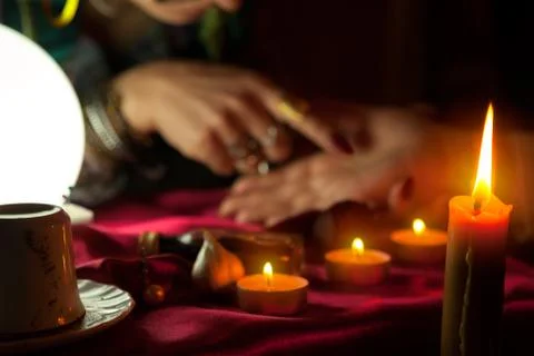 Fortune teller read a fortune from palm 스톡 사진